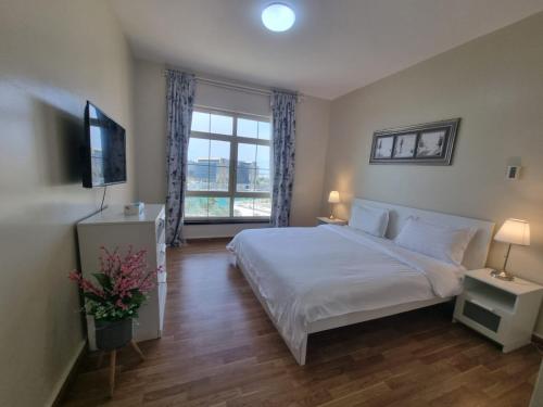 Ένα ή περισσότερα κρεβάτια σε δωμάτιο στο استوديو المارينا