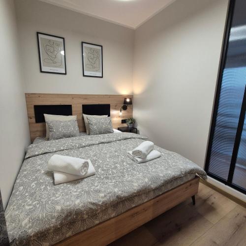 En eller flere senge i et værelse på STARCO Apartamenty obok dworca