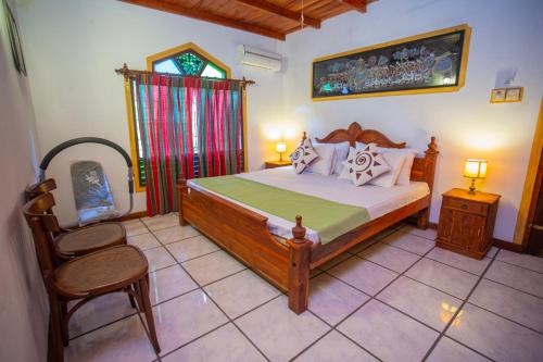 Ένα ή περισσότερα κρεβάτια σε δωμάτιο στο Golden Villa Hikkaduwa