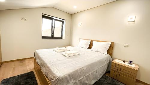 Ένα ή περισσότερα κρεβάτια σε δωμάτιο στο Casa Miradouro Fafião