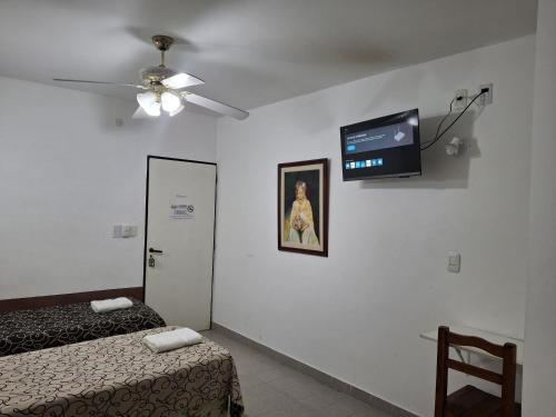 Кровать или кровати в номере Hotel Residencial Lo de Pepe