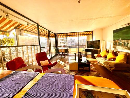 a living room with a couch and a table at sanhatan in Santiago