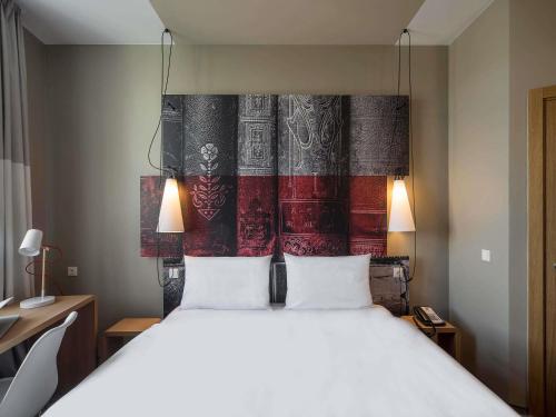 Ένα ή περισσότερα κρεβάτια σε δωμάτιο στο Ibis Riga Centre