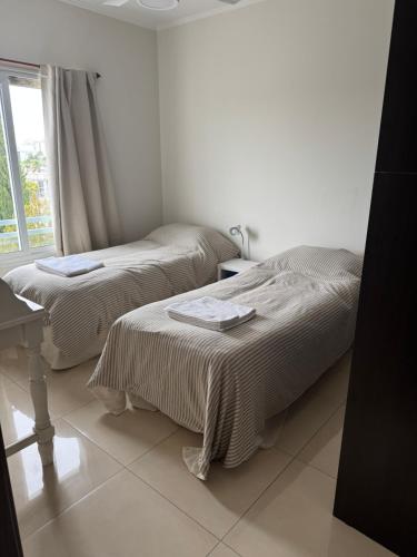 En eller flere senge i et værelse på Departamento de 2 dormitorios