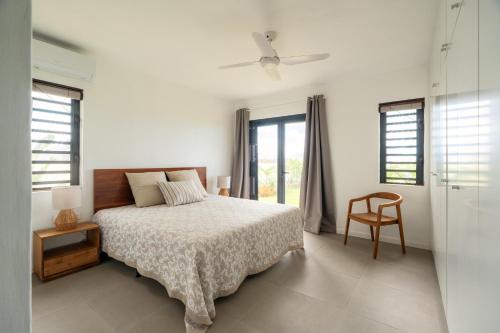 En eller flere senge i et værelse på Blue Haven