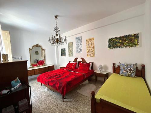 En eller flere senge i et værelse på Casa Vacanza Cleopatra Beachfront Augusta