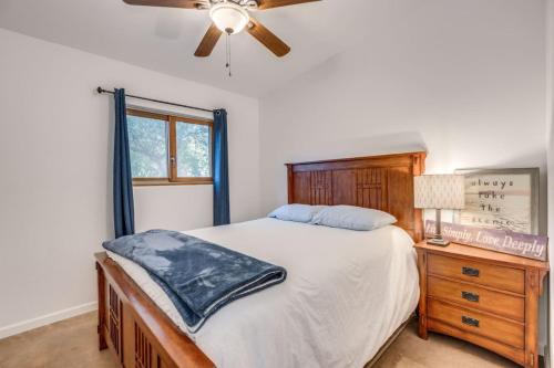a bedroom with a bed and a ceiling fan at Parkway Terrace in Tucson