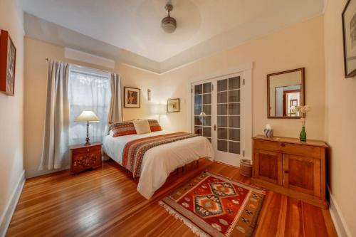 a bedroom with a bed and a dresser and a window at N 1st Ave in Tucson