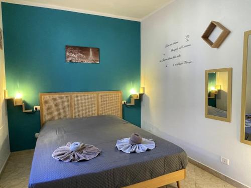 Ένα ή περισσότερα κρεβάτια σε δωμάτιο στο Cuore di Cairo - Bilocale vicino al centro storico