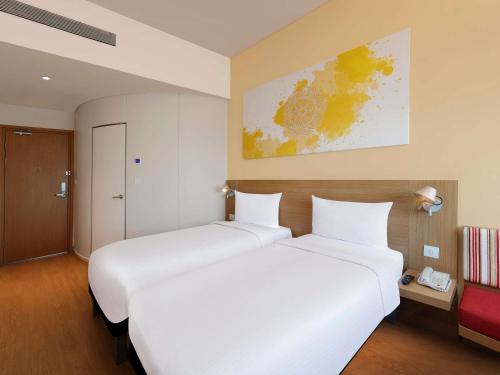 Postel nebo postele na pokoji v ubytování ibis Pune Hinjewadi - An Accor Brand