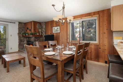 a dining room with a wooden table and chairs at Beaver Village Unit #0724 in Winter Park