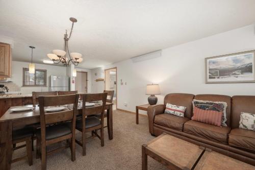a living room with a couch and a table at Beaver Village Unit #0724 in Winter Park