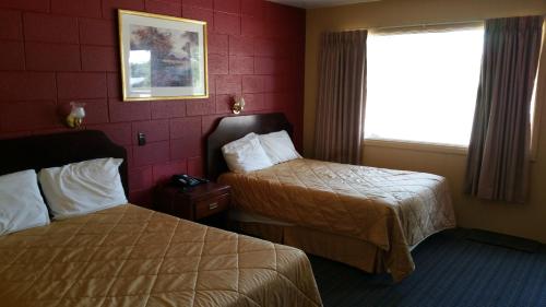 Postel nebo postele na pokoji v ubytování Riverview Motel