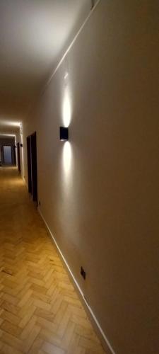 an empty hallway with a light on the wall at Lavanda Termas de São Pedro do Sul in Termas de Sao Pedro do Sul