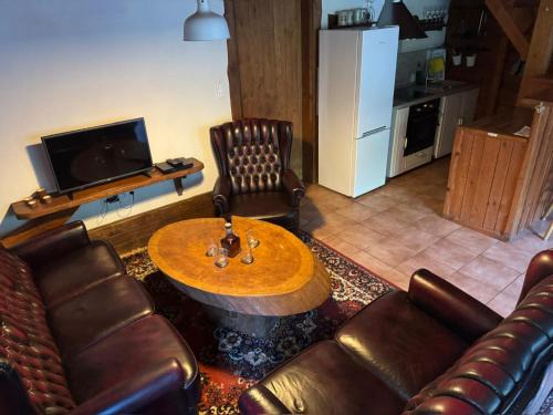 Kuchyň nebo kuchyňský kout v ubytování wellness roubenka