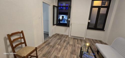 a room with a table and a chair and a window at Homeday joffre 2 type F2 Haguenau in Haguenau