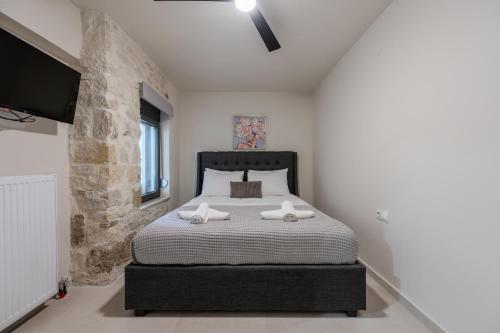 Ένα ή περισσότερα κρεβάτια σε δωμάτιο στο Stone project-2-