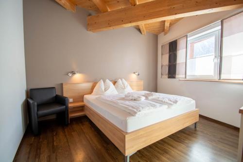 Кровать или кровати в номере Apartments am Bärenkopf