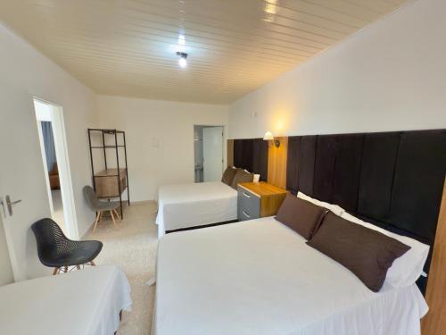 En eller flere senge i et værelse på Juquehy Studios 5