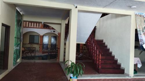 a view of the hallway of a house with a staircase at Ch Aeropuerto Cuernavaca in Temixco