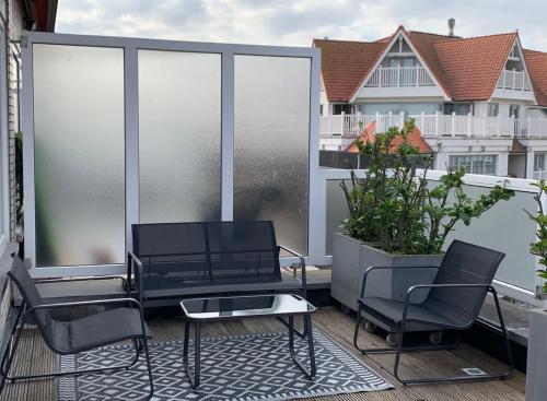 Un balcon sau o terasă la Très beau penthouse à Knokke