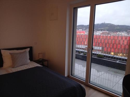 Кровать или кровати в номере Riverside Apartments