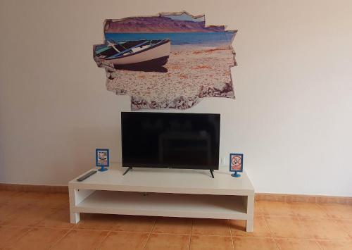 Et tv og/eller underholdning på Apartamento Azul