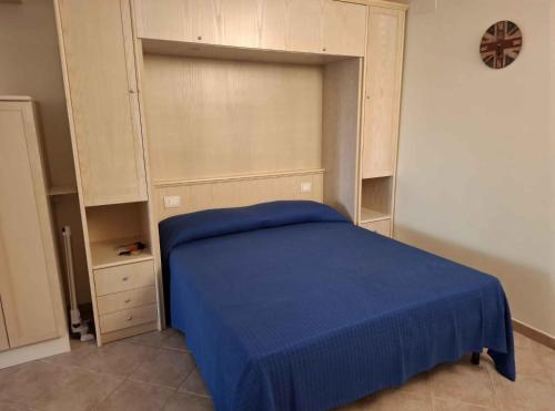 Giường trong phòng chung tại Appartamenti Verde Blu