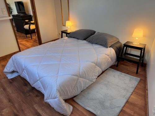 Ένα ή περισσότερα κρεβάτια σε δωμάτιο στο La Mansarde