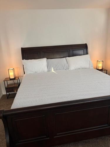 a bedroom with a large bed with white sheets and pillows at Desert Vista View in Desert Hot Springs