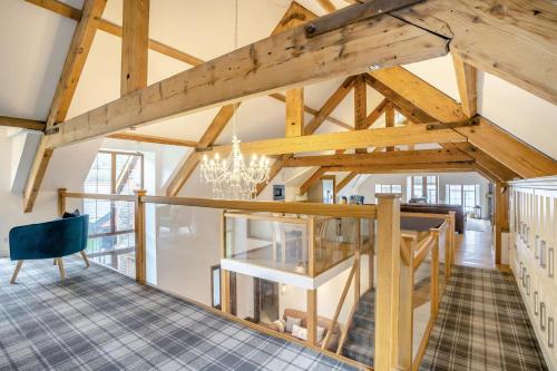 a large room with wooden ceilings and a chandelier at 6 Bed in Blaencwm oc-t32688 in Blaencwm