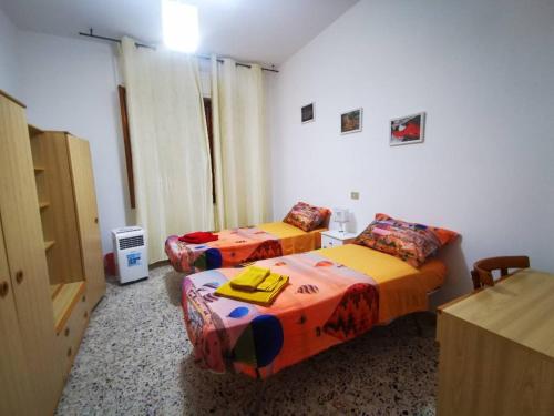 Ένα ή περισσότερα κρεβάτια σε δωμάτιο στο Casa Bonaria