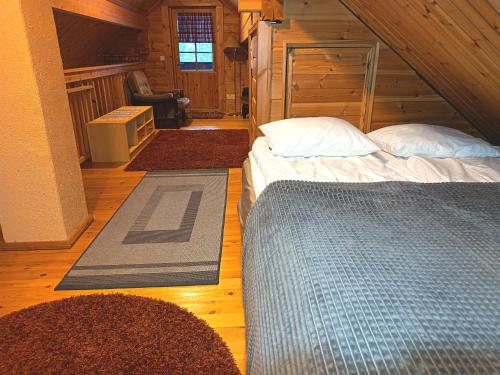 Postel nebo postele na pokoji v ubytování Villa Joiku