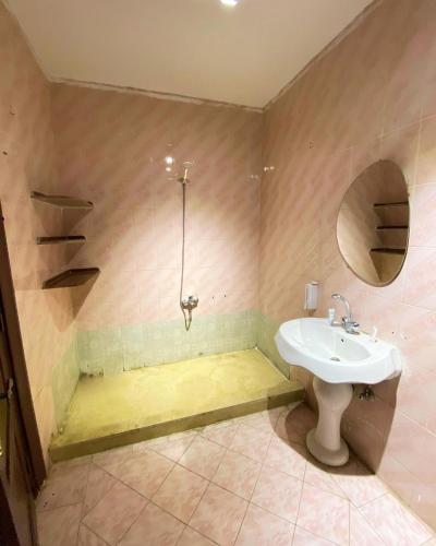 a bathroom with a sink and a shower at Alex inn Rooms in Alexandria