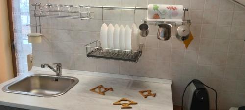 a kitchen counter with a sink and utensils at Colle dell'Ara in Chieti