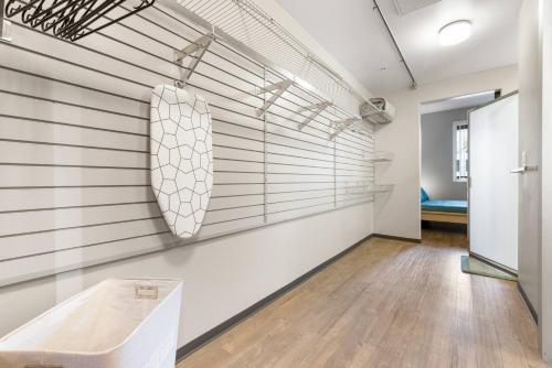 a room with white walls and wooden floors at Irvine Luxury Living | Pool, Gym & Prime Location in Irvine