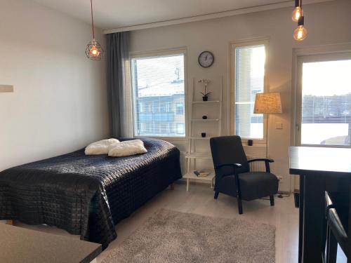 Ένα ή περισσότερα κρεβάτια σε δωμάτιο στο Yksiö Mimosa