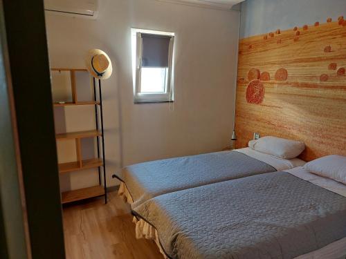 Postel nebo postele na pokoji v ubytování Casa da Ermida Cottage with Jacuzzi and fantastic views