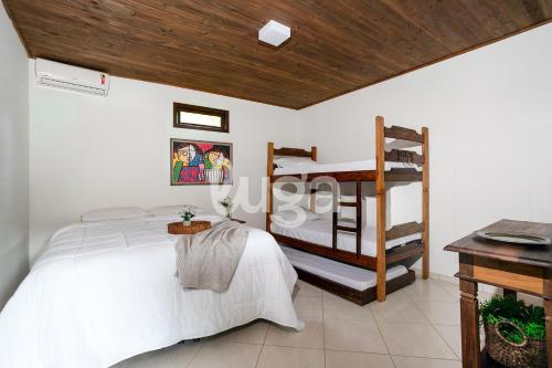 Ένα ή περισσότερα κρεβάτια σε δωμάτιο στο Sítio 4 Estações | Paz e Natureza