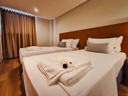 Postel nebo postele na pokoji v ubytování Amazon Seasons hotel