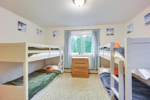 a bedroom with three bunk beds and a window at 4 Mi to Bromley Mtn Family-Friendly Retreat! in Landgrove Town Center