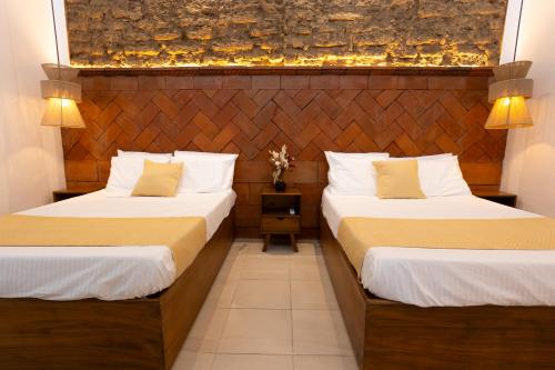 Un pat sau paturi într-o cameră la Casa Sofi Oaxaca