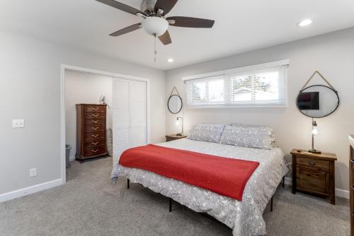 a bedroom with a bed and a ceiling fan at Updated 2bed 2bath perfect for golfers, business travelers, and families in Greensboro
