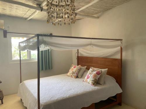 Ένα ή περισσότερα κρεβάτια σε δωμάτιο στο Casa dos Tim