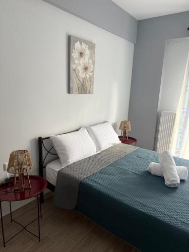 Ένα ή περισσότερα κρεβάτια σε δωμάτιο στο Papi's Cozy Apartment