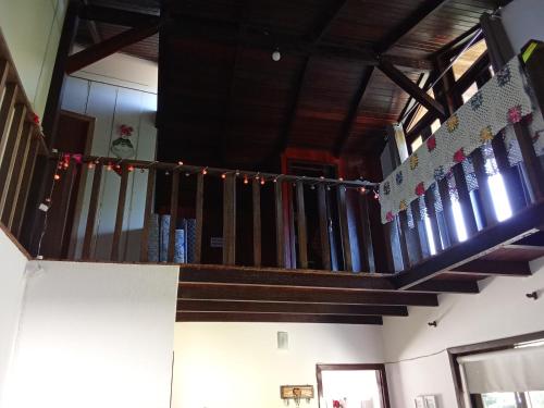 a staircase with christmas lights on it in a house at Hostel pousada floresta in Joinville
