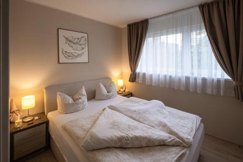 Ένα ή περισσότερα κρεβάτια σε δωμάτιο στο Kriszta Residence