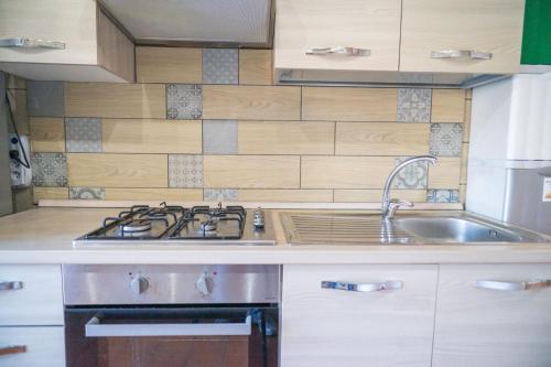 Kuchyň nebo kuchyňský kout v ubytování P&P Bergamo Apartment