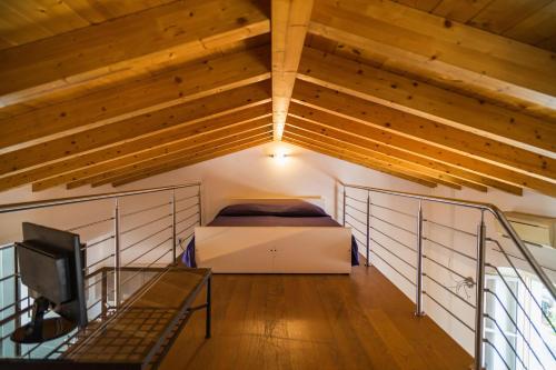 Ένα ή περισσότερα κρεβάτια σε δωμάτιο στο P&P Suite Tiraboschi