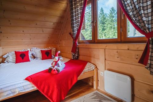 En eller flere senge i et værelse på Widokowe Domki Kościelisko